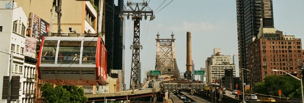 A photo of approaching the Ed Koch Queensboro Bridge bridge taken from a Roosevelt Island bound cable car on Kono film 
